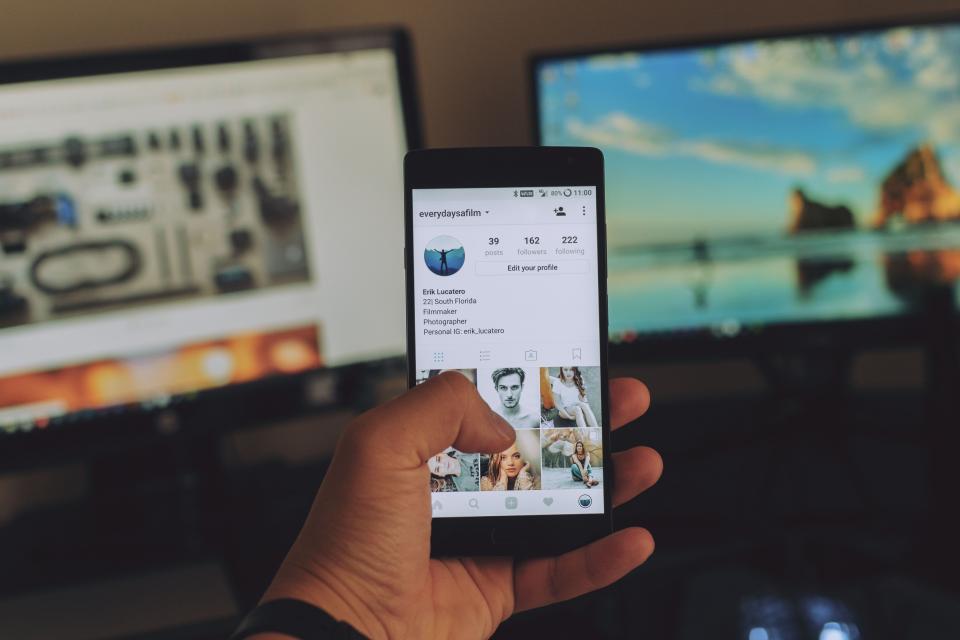 A Person scrolling social media on a mobile phone